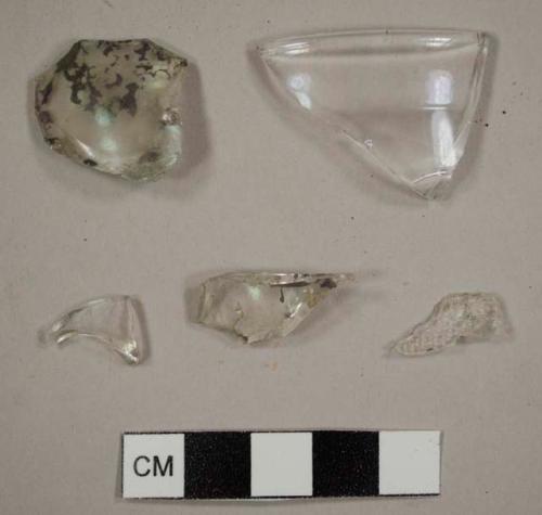 Colorless bottle glass fragment including rim fragment to a tumbler