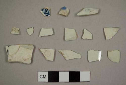 Pearlware sherds, one with handpainted blue design and one with plain blue glaze, one plate rim sherd