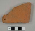 Brick tile fragment, possibly from a roof tile