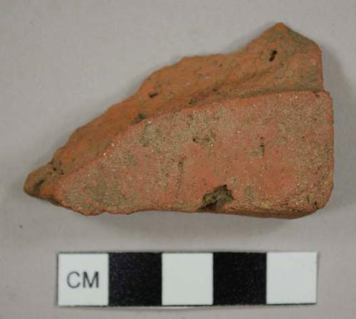 Handmade brick tile, most likely a roof tile