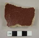 Brown slip-glazed coarse earthenware drain pipe sherd