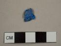 Blue plastic fragment, possibly a pen cap