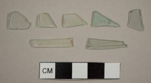 Flat glass fragments, four colorless and three aqua