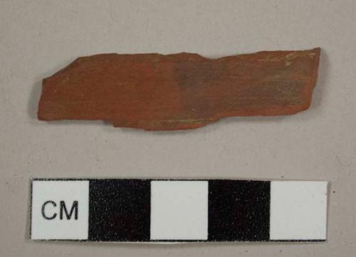 Refined red earthenware sherd, possibly a tile fragment