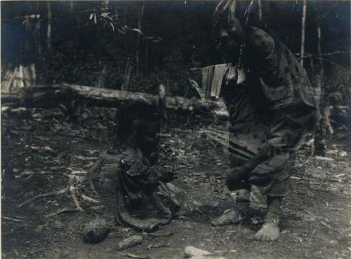 Children, one smoking a cigar