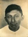 Frontal facial portrait of a Maya boy