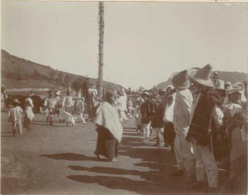 Dancing around the pole of the Volador at an Aztec festival