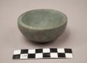 Ground stone miniature bowl, round bottom, grey slate