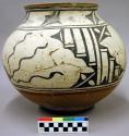 Pottery olla. Globular with concave base, slightly outcurving rim, tan base and