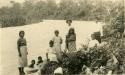 "Talamanca Indian Princess taking her morning dip" - A group on the shore of the Sixaola River