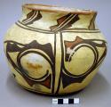 Jar, polacca polychrome style c. zuni rain bird design. 18.0 x 21.7 cm.