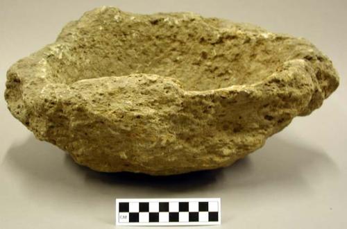 Ground stone bowl, two handles