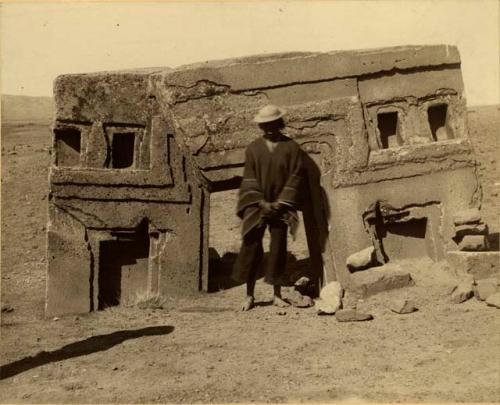 Man standing with ruins