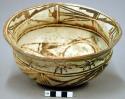 Bowl, polacca polychrome style c. int: zuni rain bird design; ext: plant design.