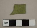 Olive green flat glass fragment