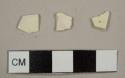 Creamware sherds, including one thin plate rim