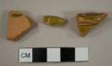 Lead glazed earthenware sherds, including two rim sherds to hollowware vessels, possibly the same vessel