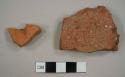 Brick roof tile fragments; one with nail hole