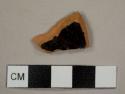 Black lead-glazed red earthenware sherd