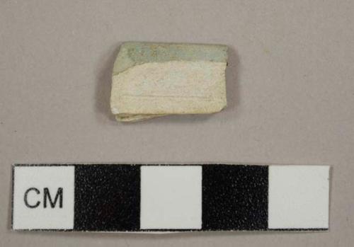 Refined white earthenware sherd, possibly pearlware, burned