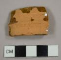 Lead-glazed red earthenware handle sherd, possibly from a pitcher
