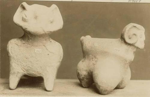 Two stone figures