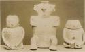Three clay human figures