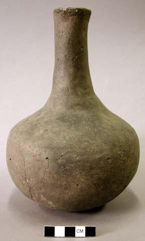 Ceramic vessel, long neck, slightly flared, plain.