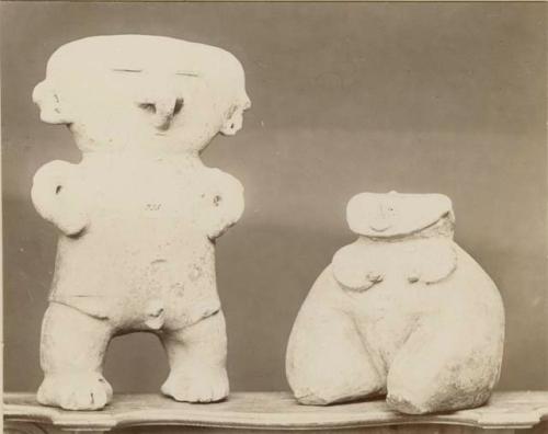 Two clay figures, a man and woman