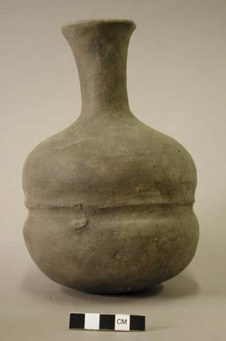 Ceramic complete vessel, body has two lobes with a ridge running between them, l