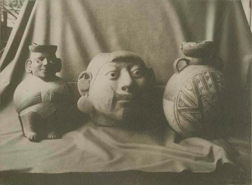 Carved head, effigy vase and decorated vase