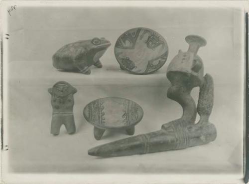 Collection of pottery bowls and figures