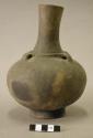 Ceramic complete vessel, footed ring, long neck, flared rim, ridge around base o