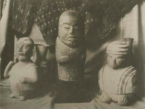 Moche effigy vessels and stone figure