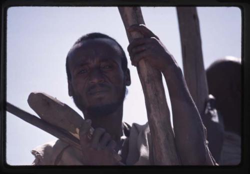 Man working in salt flats - Dallol Depression, Ethiopia