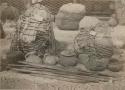 Mummies, ceramic vessels and poles