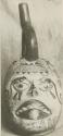 Effigy pottery vase showing ulceration of lips and mutilation of the nose