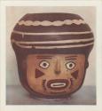 Stylized pottery vessel, painted like a face