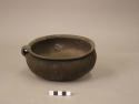 Pottery toasting pot- blackened by smoke; miniature handle; 7.5 " diameter