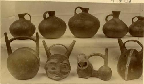 Ceramic vessels, including one in the shape of a human head and one in the shape of a bird