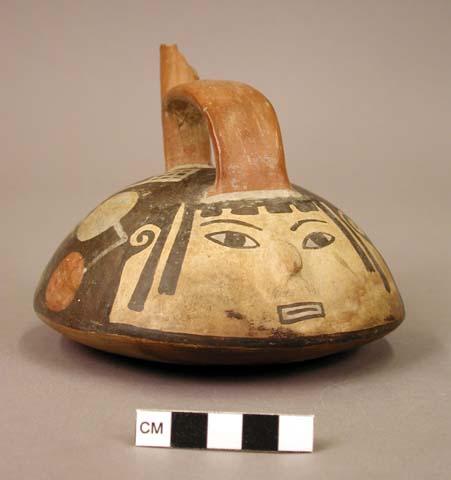 Polychrome dome shaped, bridge and spout bottle.