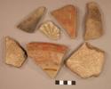 Ceramic rim and body sherds, 3 red on buff, 1 modeled starburst pattern,