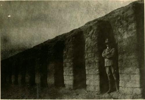 Man stands in a wall niche at Pachacamac