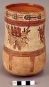 Vase painted in polychrome with marine animals and four mythical faces