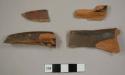 Crock rim sherds from at least two different red earthenware vessels with black or brown lead glaze; two mend together