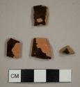 Lead-glazed red earthenware sherds, including one rim sherd for a cup or bowl