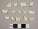 Creamware sherds, nine body sherds, two cup rim sherds, one plate rim sherd, and one with ribbing, possibly a handle from a teapot