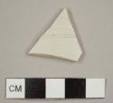 White, salt-glazed stoneware sherd with molded, wheel-turned ribbing on exterior