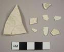 Creamware sherds, including one plate rim and one marley-to-base sherd