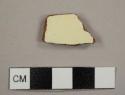 Lead-glazed red earthenware sherd with brown exterior and cream interior slip